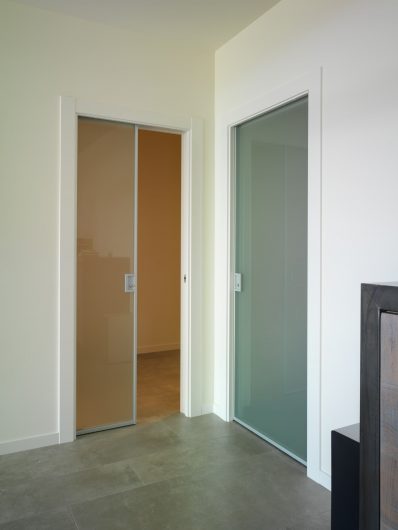 View of two internal sliding doors in aluminum and glass