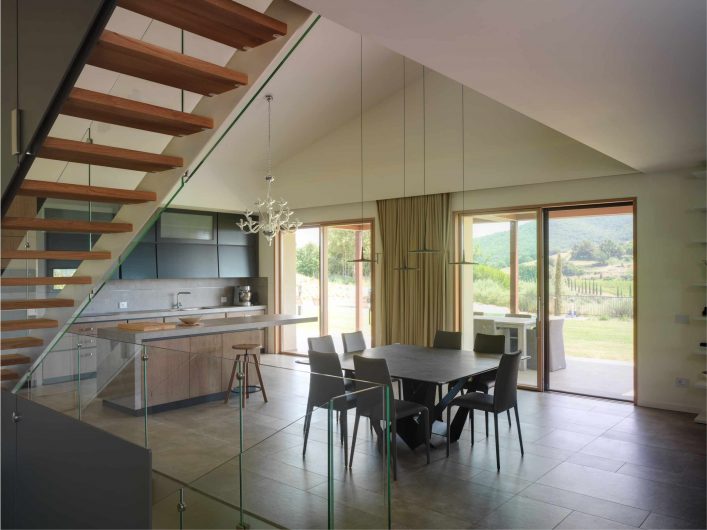 View of the open space with lift and slide doors in oak with a natural finish